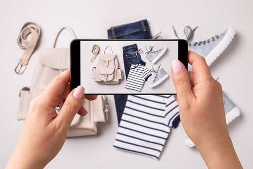 Woman,Taking,Photo,Of,Clothes,(jeans,,T-shirt,,Sneakers,,Backpack),With